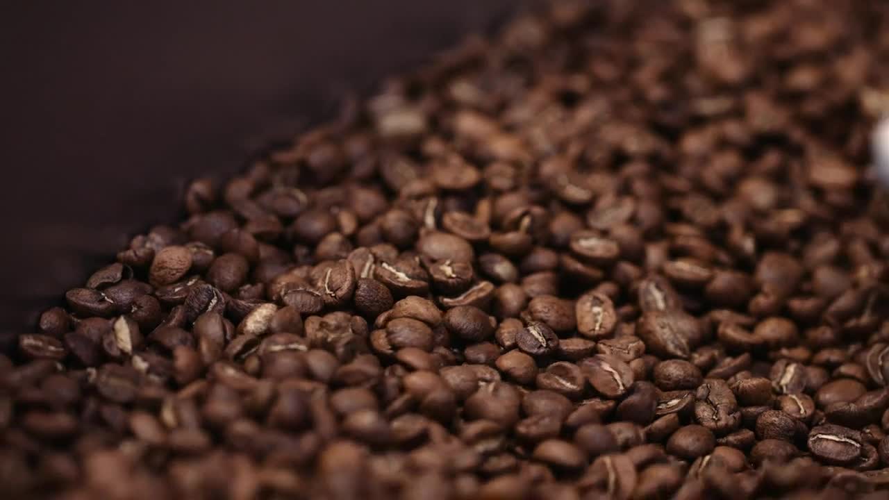 Download Video Stock Closeup Of Coffee Beans In A Coffee Roaster Live Wallpaper For PC