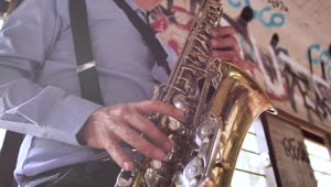 Download Video Stock Close Up Of A Saxophonist In An Abandoned Spot Live Wallpaper For PC