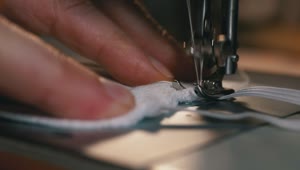 Download Video Stock Close Up Of A Person Sewing A Face Mask Live Wallpaper For PC