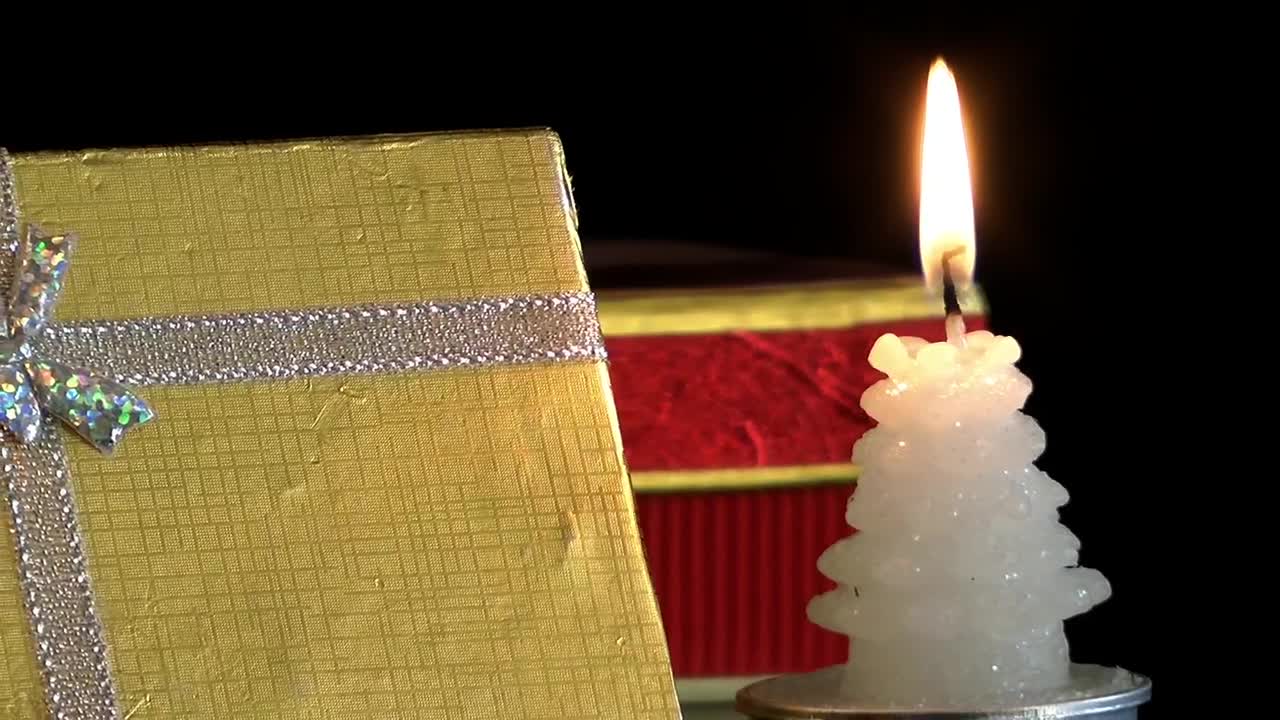 Download Video Stock Christmas Gift Box And A Candle Live Wallpaper For PC