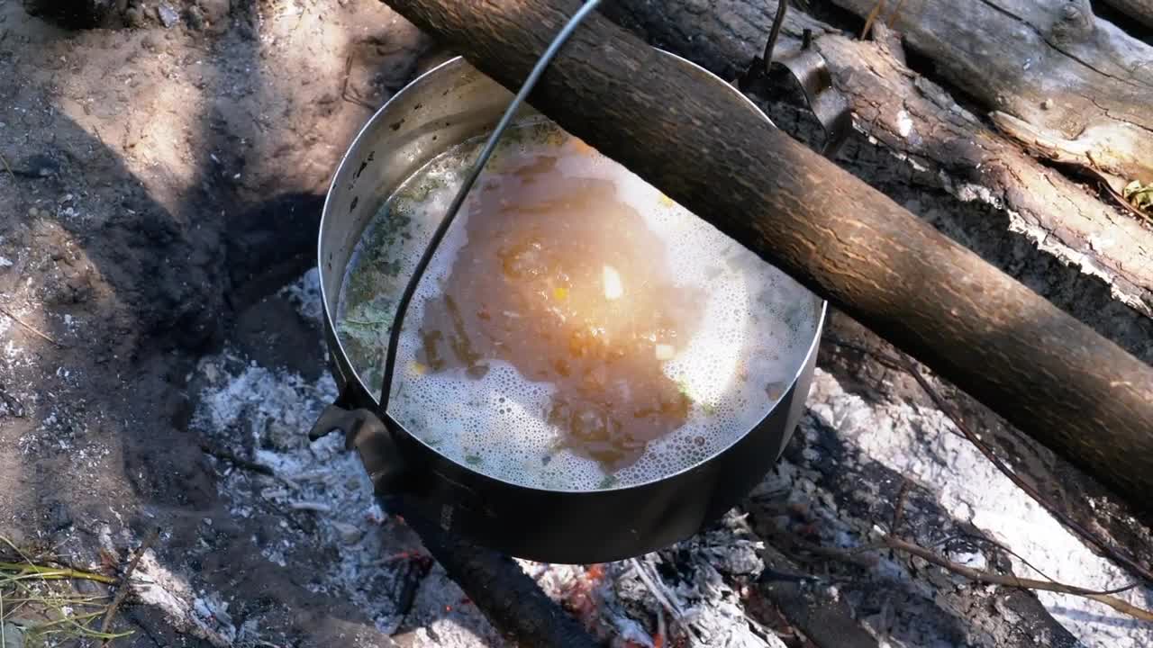 Download Video Stock Casserole With Boiling Water On A Campfire Live Wallpaper For PC