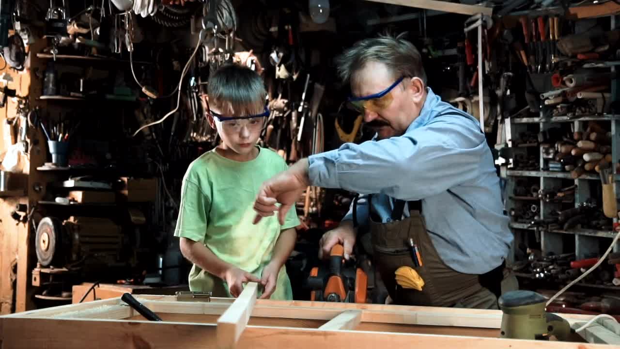 Download Video Stock Carpenter And Grandson In The Workshop Live Wallpaper For PC