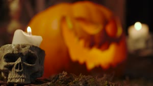 Download Video Stock Candles On The Sides Of A Lighted Halloween Pumpkin Live Wallpaper For PC