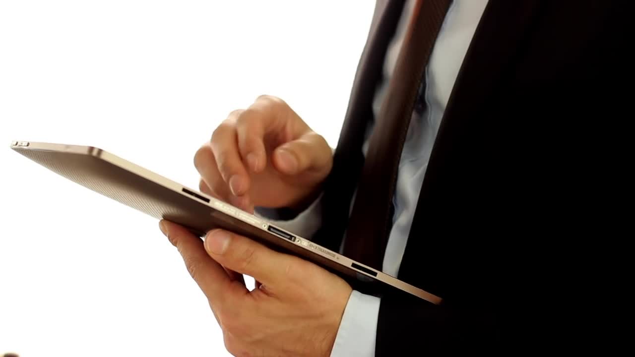 Download Video Stock Businessman Wearing A Suit And Using A Tablet Live Wallpaper For PC