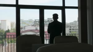 Download Video Stock Businessman Looking Out The Window Live Wallpaper For PC