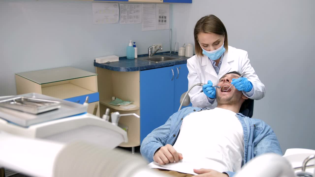 Download Stock Video Dentist Treating Teeth At Her Clinic Live Wallpaper For PC