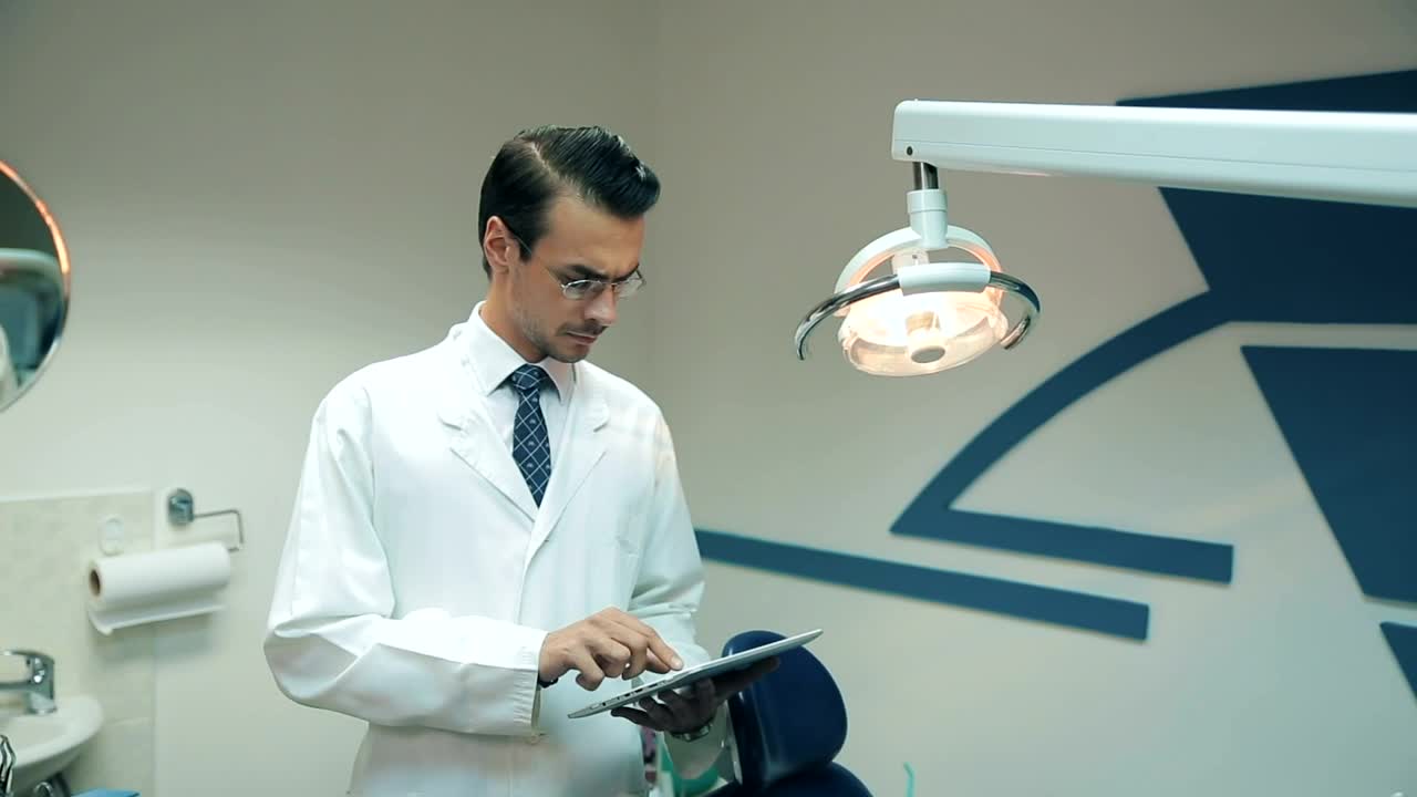 Download Stock Video Dentist Reviewing Data On His Tablet Live Wallpaper For PC