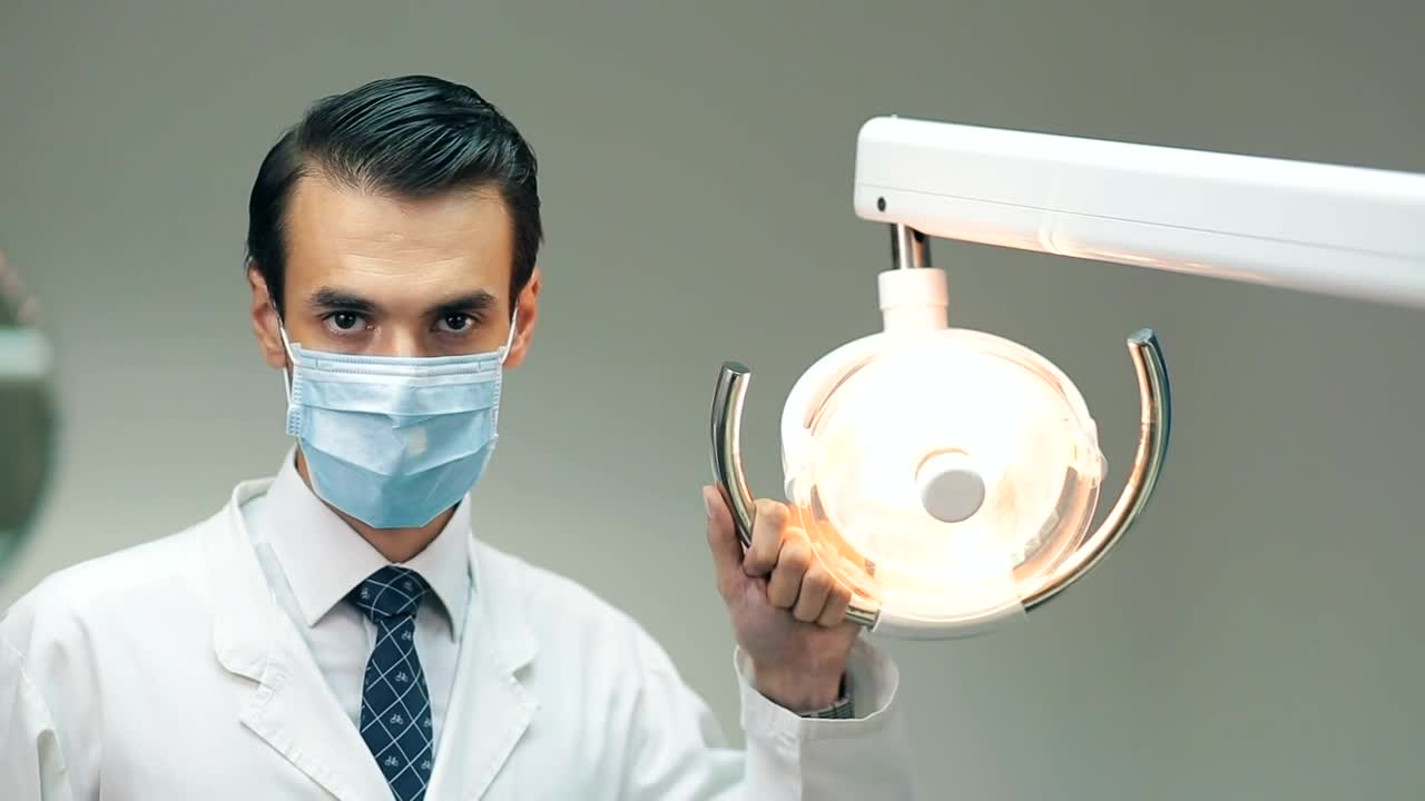 Download Stock Video Dentist Holding A Lamp In His Office Live Wallpaper For PC