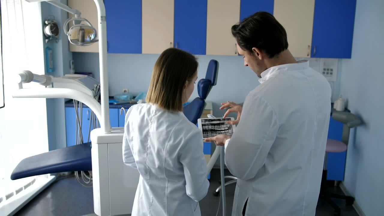 Download Stock Video Dental Staff Using A Tablet Computer Live Wallpaper For PC