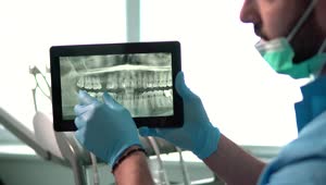 Download Stock Video Dental Nurse Explains Teeth X Ray On Tablet Live Wallpaper For PC