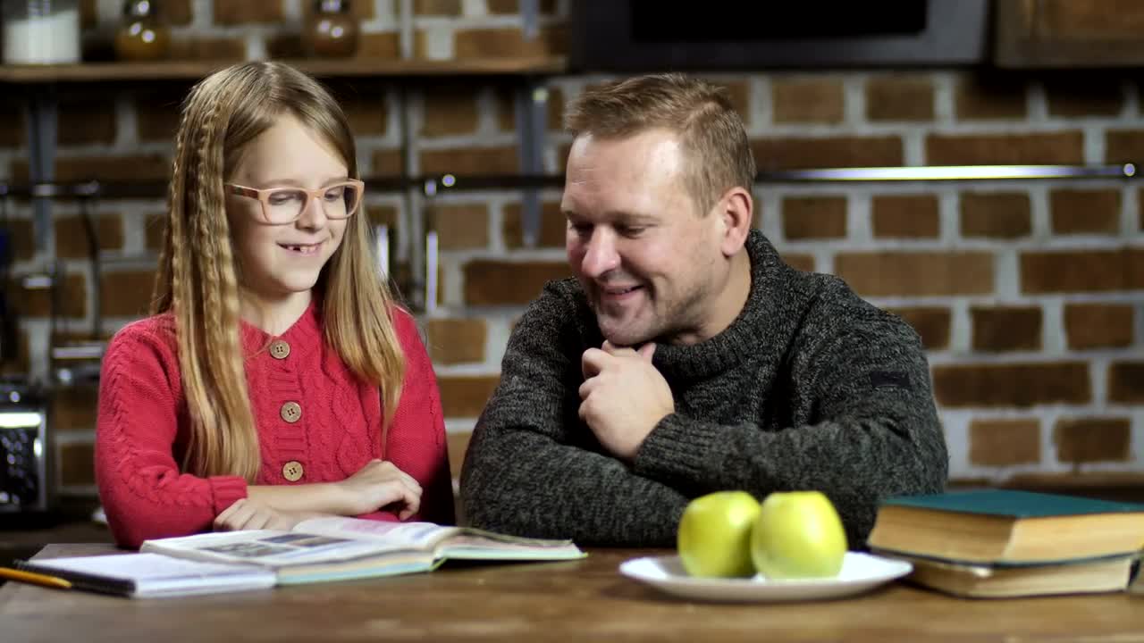 Download Stock Video Dad Helping His Daughter With Her Homework Live Wallpaper For PC