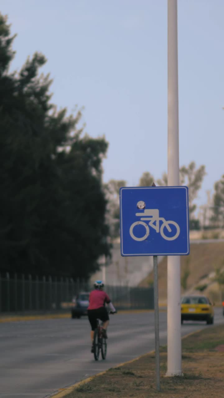 Download Stock Video Cyclist Sign Next To A Road Vertical Shot Live Wallpaper For PC