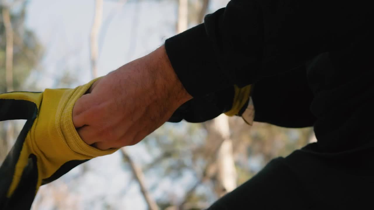 Download Stock Video Cyclist Puts On Gloves And Before Starting To Ride Live Wallpaper For PC