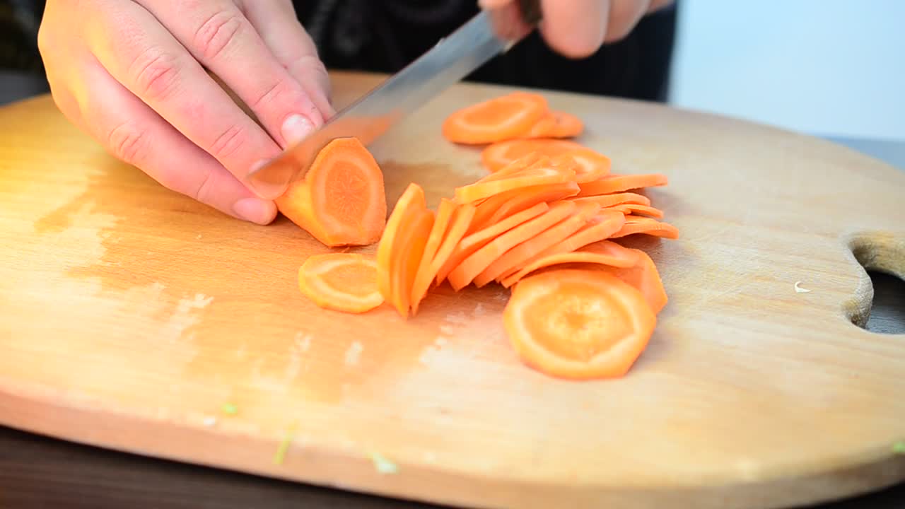 Download Stock Video Cutting Up Carrots On A Chopping Board Live Wallpaper For PC