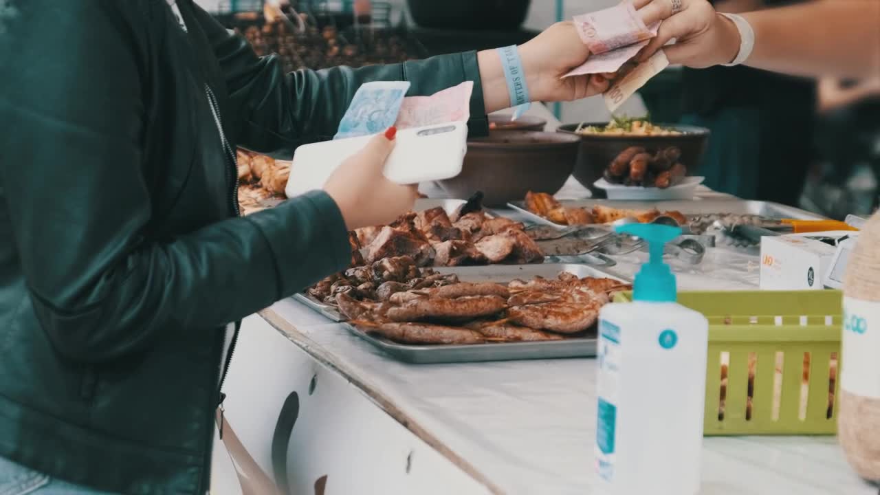 Download Stock Video Customer Buying Grilled Meat At The Market Live Wallpaper For PC