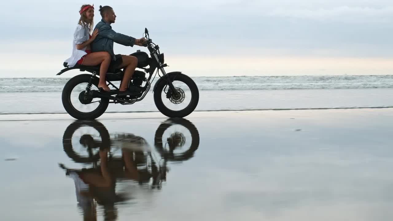 Download Stock Video Couple Riding A Motorcycle In The Beach Live Wallpaper For PC