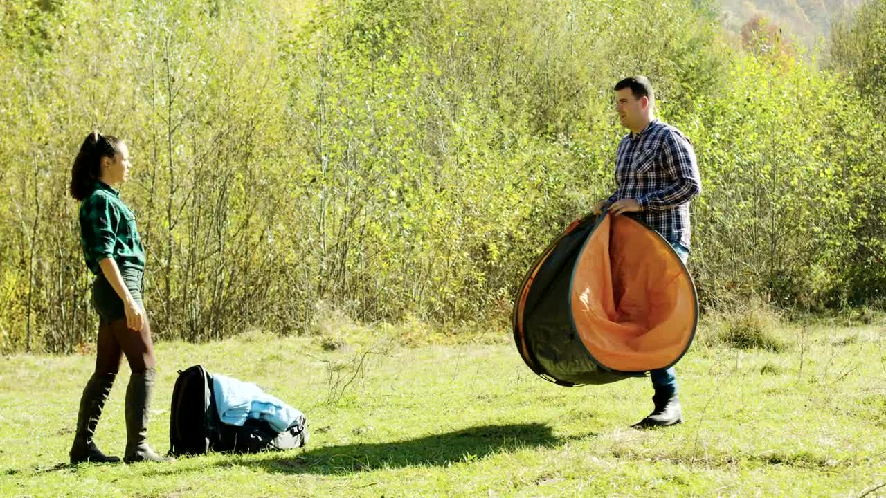 Download Stock Video Couple Preparing A Tent For The Night Live Wallpaper For PC