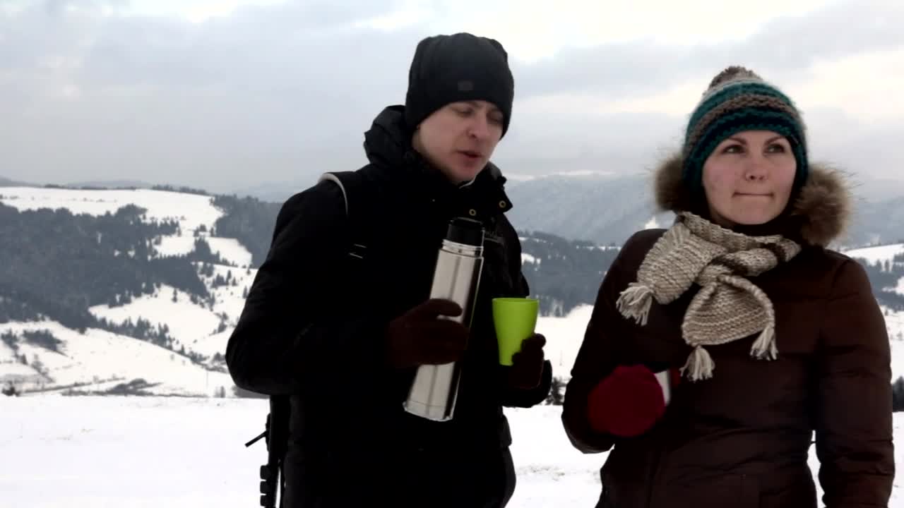 Download Stock Video Couple Having Tea In A Snowy Mountain Landscape Live Wallpaper For PC