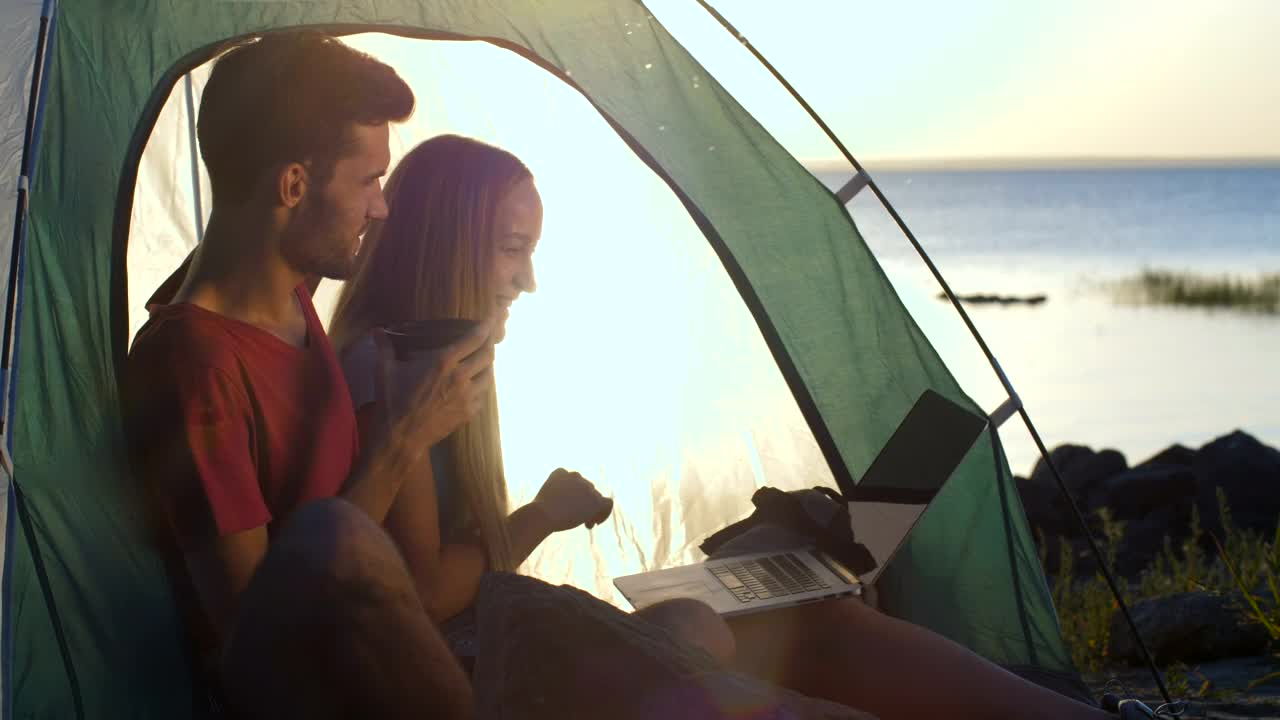 Download Stock Video Couple Having A Video Call While Camping Live Wallpaper For PC