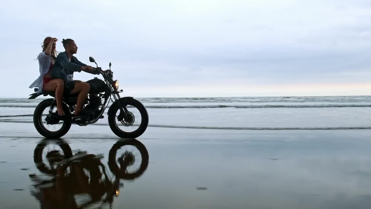 Download Stock Video Couple Enjoying A Motorcycle Trip On Their Beach Vacation Live Wallpaper For PC