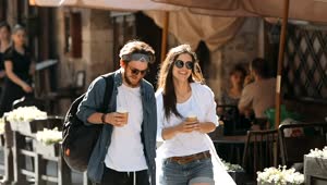 Download Stock Video Couple Enjoy Friendship While Walking On City Street Live Wallpaper For PC