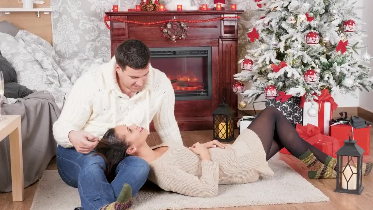 Download Stock Video Couple Enjoy Christmas Romance In Front Of Fireplace Live Wallpaper For PC