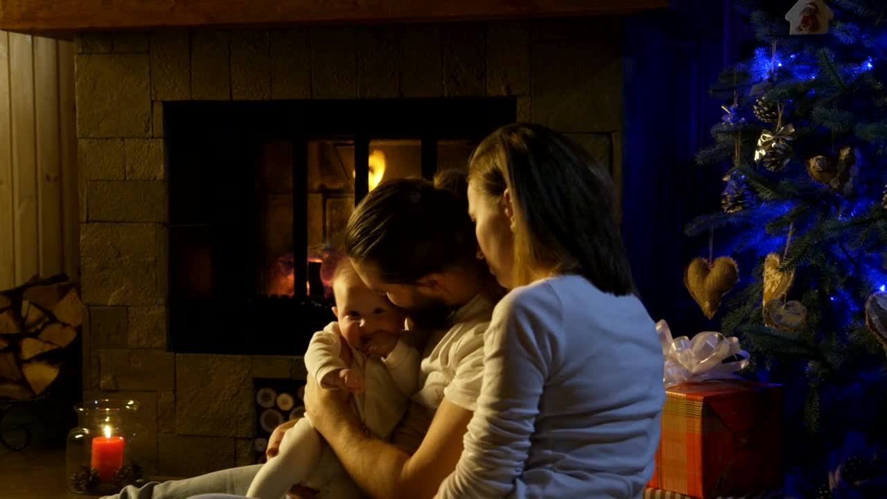 Download Stock Video Couple And Baby Near The Fireplace Live Wallpaper For PC