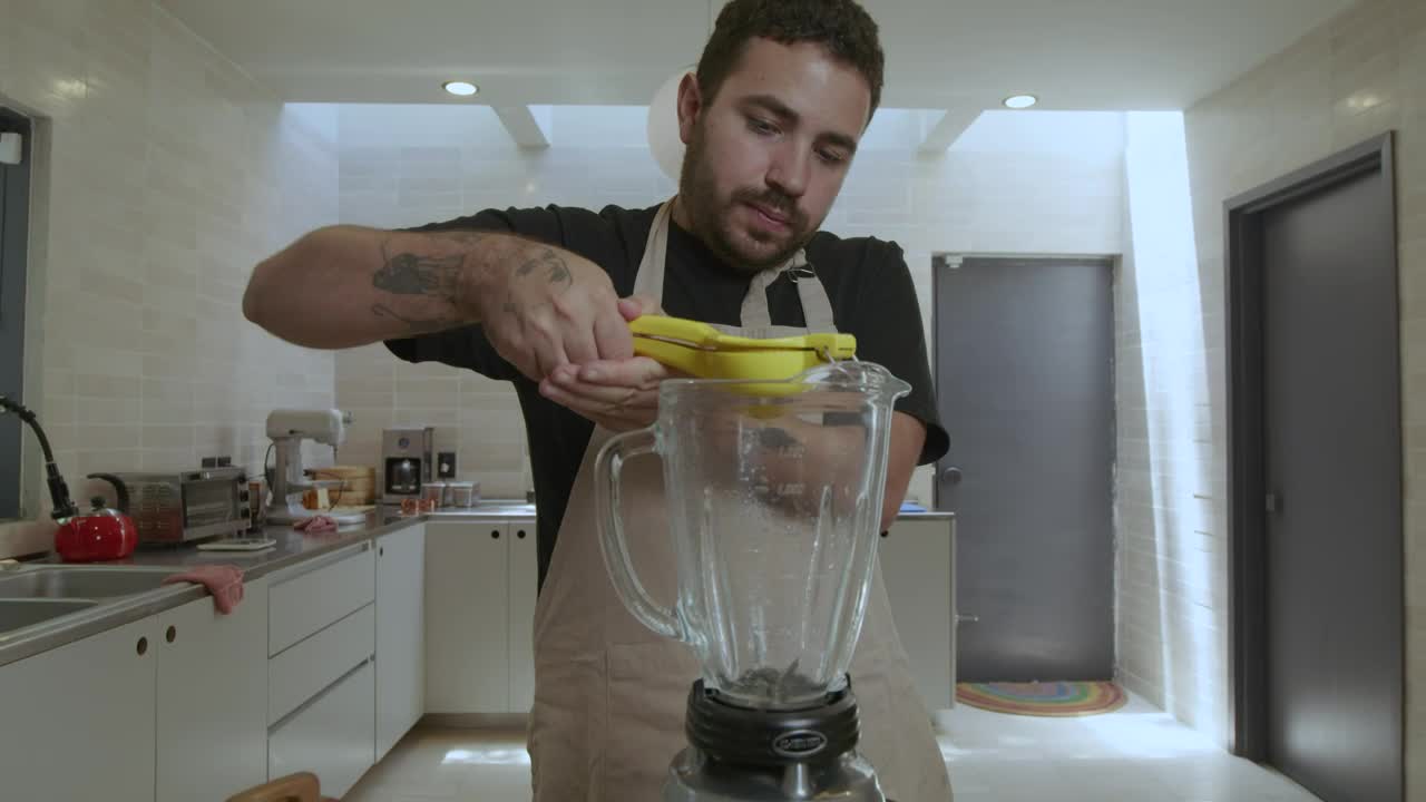 Download Stock Video Cook Adding Lemon To A Blender Live Wallpaper For PC