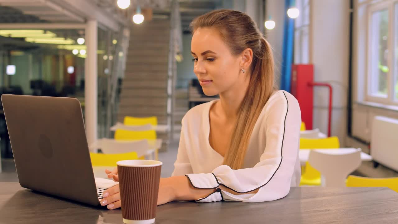 Download Stock Video Concentrated Young Entrepreneur Typing On Her Computer Live Wallpaper For PC