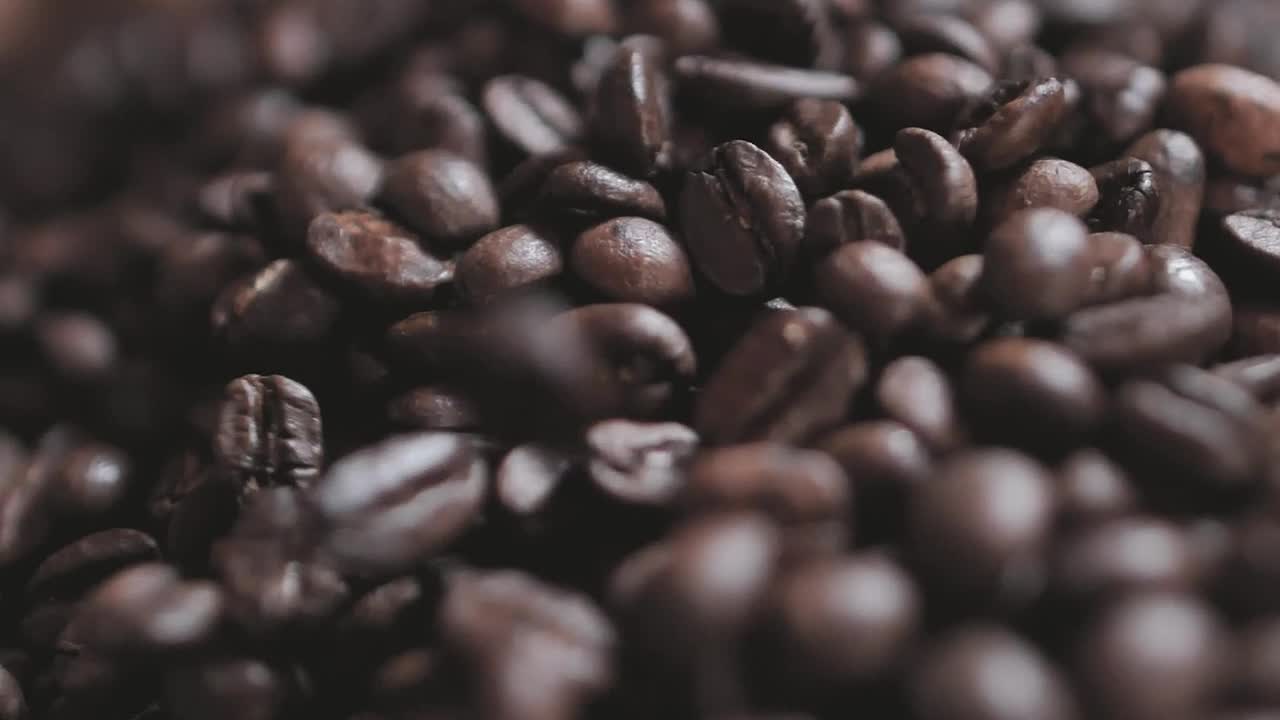 Download Stock Video Coffee Beans Falling On A Layer Of More Beans Live Wallpaper For PC