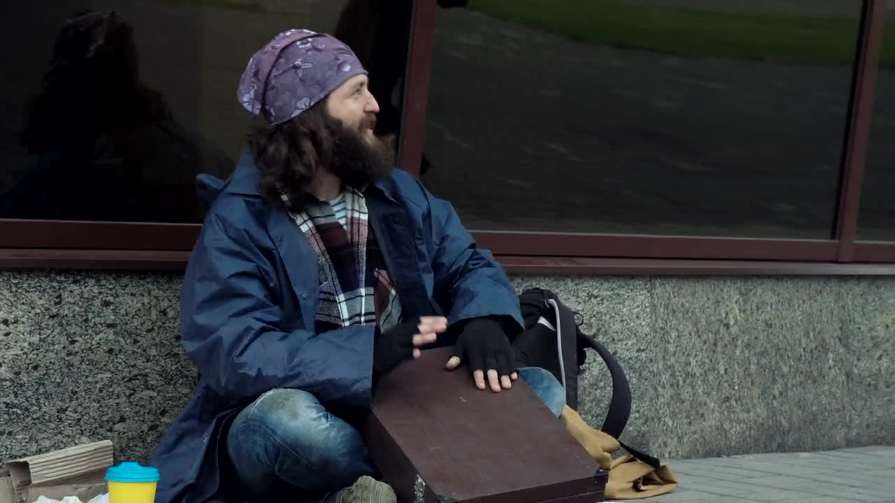 Download Stock Video Excited Happy Homeless Is Drumming On A Briefcase Live Wallpaper For PC