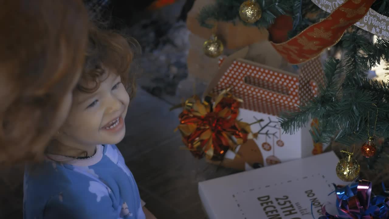 Download Stock Video Excited Girl Opening Gifts On Christmas Morning Live Wallpaper For PC