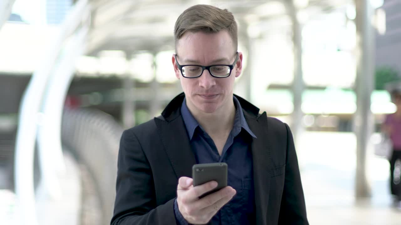 Download Stock Video Entrepreneur Young Man Wearing Glasses On A Call Live Wallpaper For PC