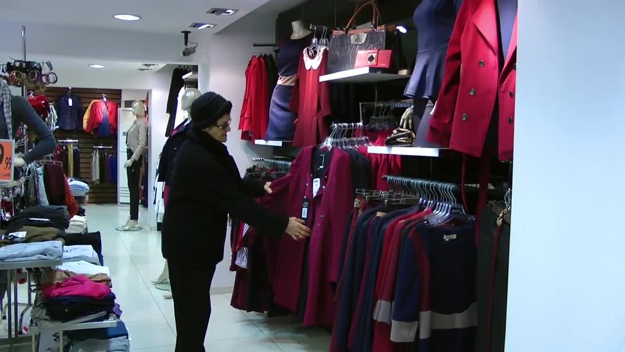 Download Stock Video Elderly Woman Shopping For Clothes Live Wallpaper For PC