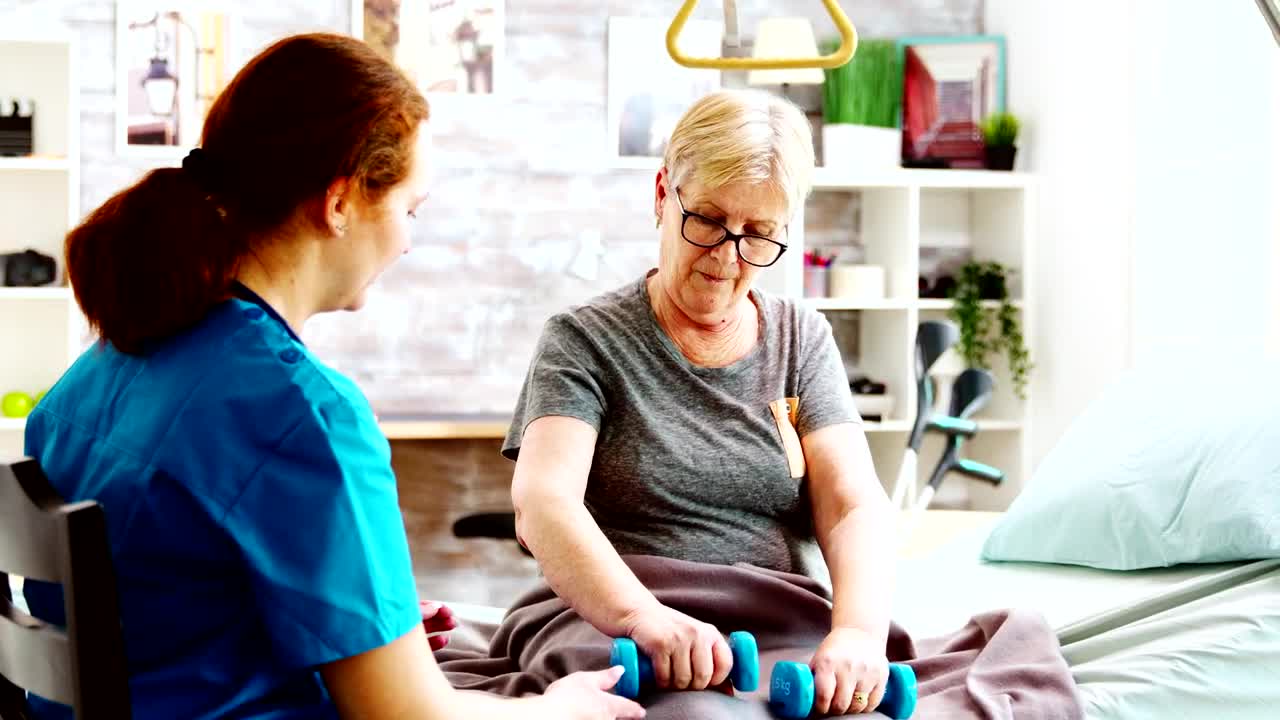 Download Stock Video Elderly Woman In Physical Therapy With Nurse Live Wallpaper For PC