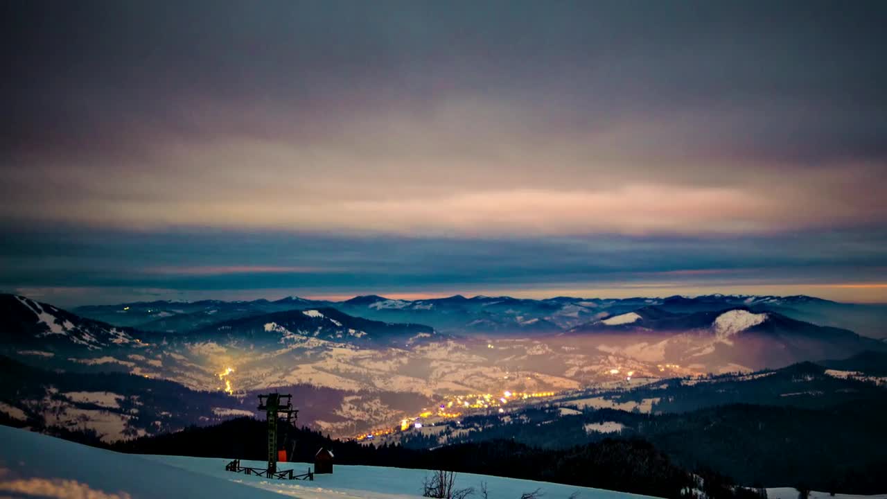 Download Stock Video Dusk From The Top Of A Snowy And Cloudy Mountain Live Wallpaper For PC