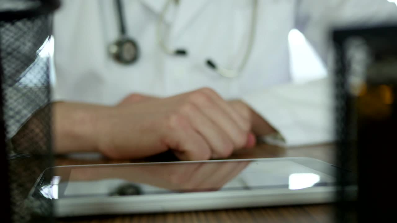 Download Stock Video Doctor Typing On A Tablet In The Desk Live Wallpaper For PC