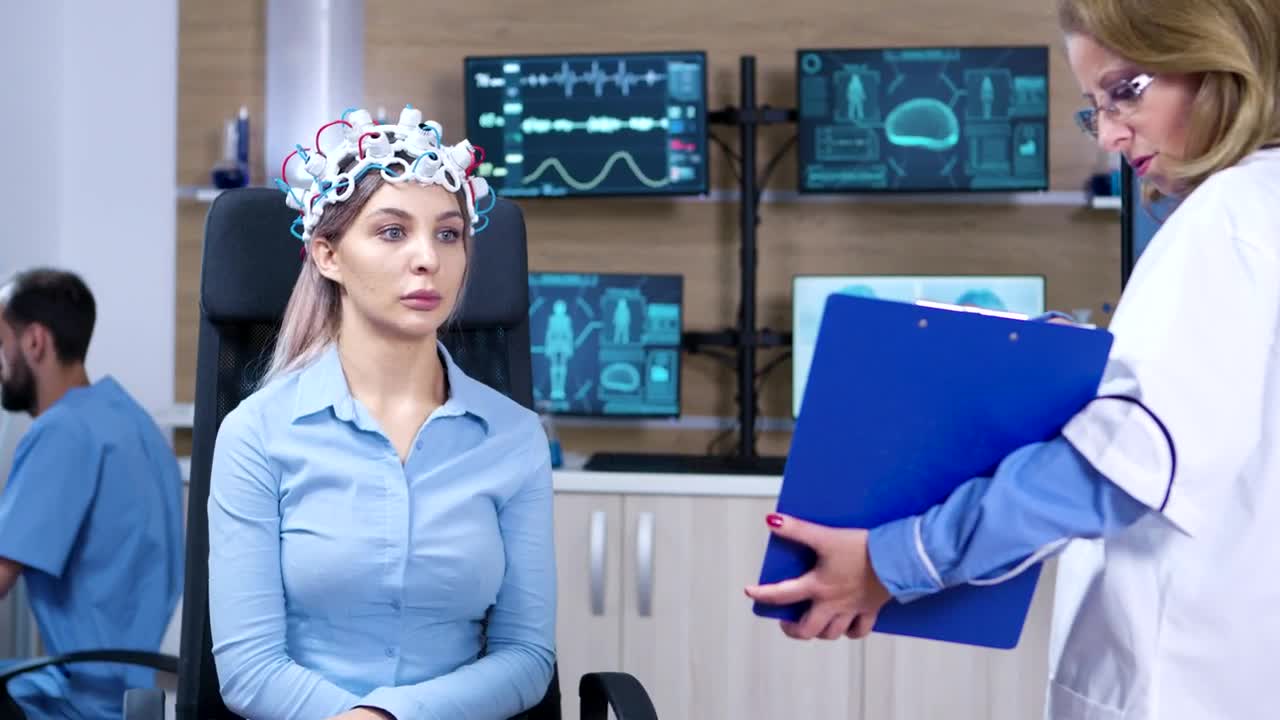 Download Stock Video Doctor Shows Results Of Brain Scan To Patient Live Wallpaper For PC