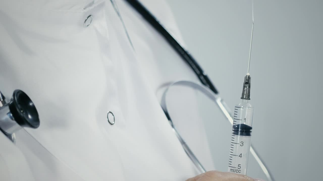 Download Stock Video Doctor Holding A Syringe Live Wallpaper For PC