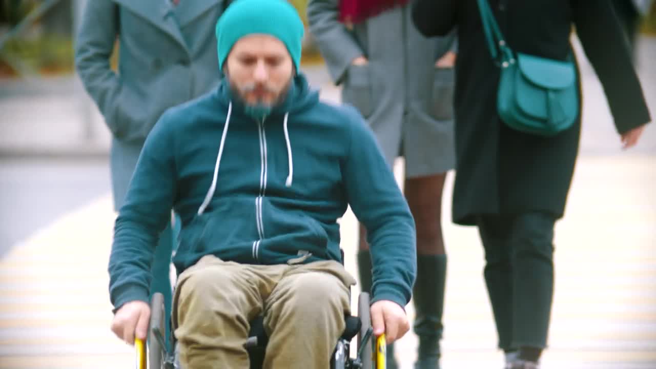 Download Stock Video Disabled Man In A Wheelchair On The Street Live Wallpaper For PC