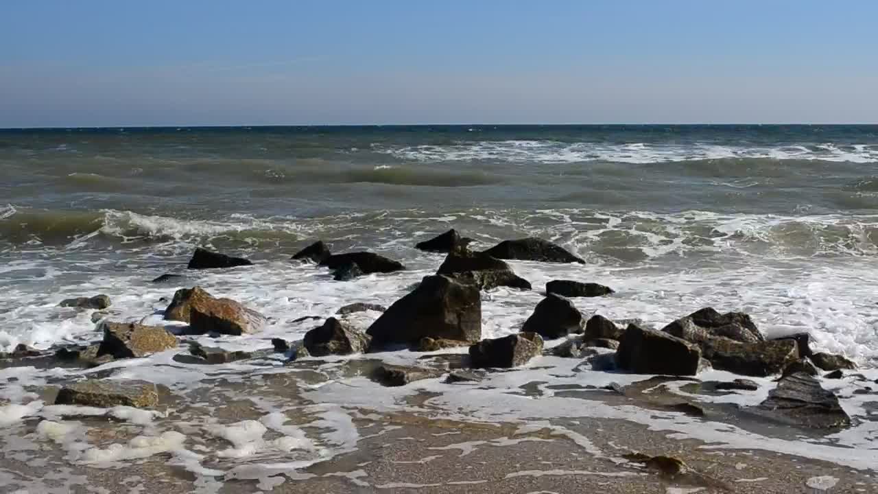 Download Stock Video Dirty Seawater Breaking Over Rocks Live Wallpaper For PC