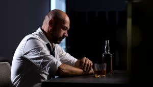 Download Stock Video Depressed Man With A Bottle Of Whisky Live Wallpaper For PC