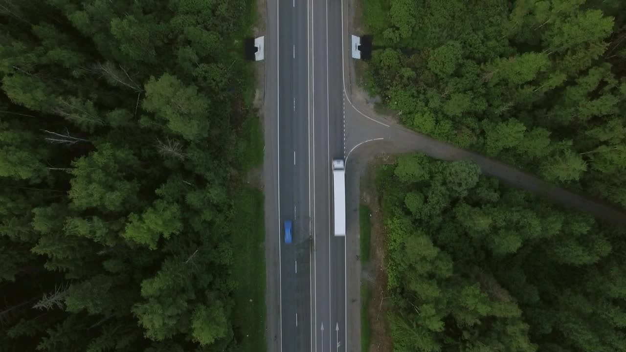 Download Stock Video Freight Trucks Heading Through A Forest Live Wallpaper For PC