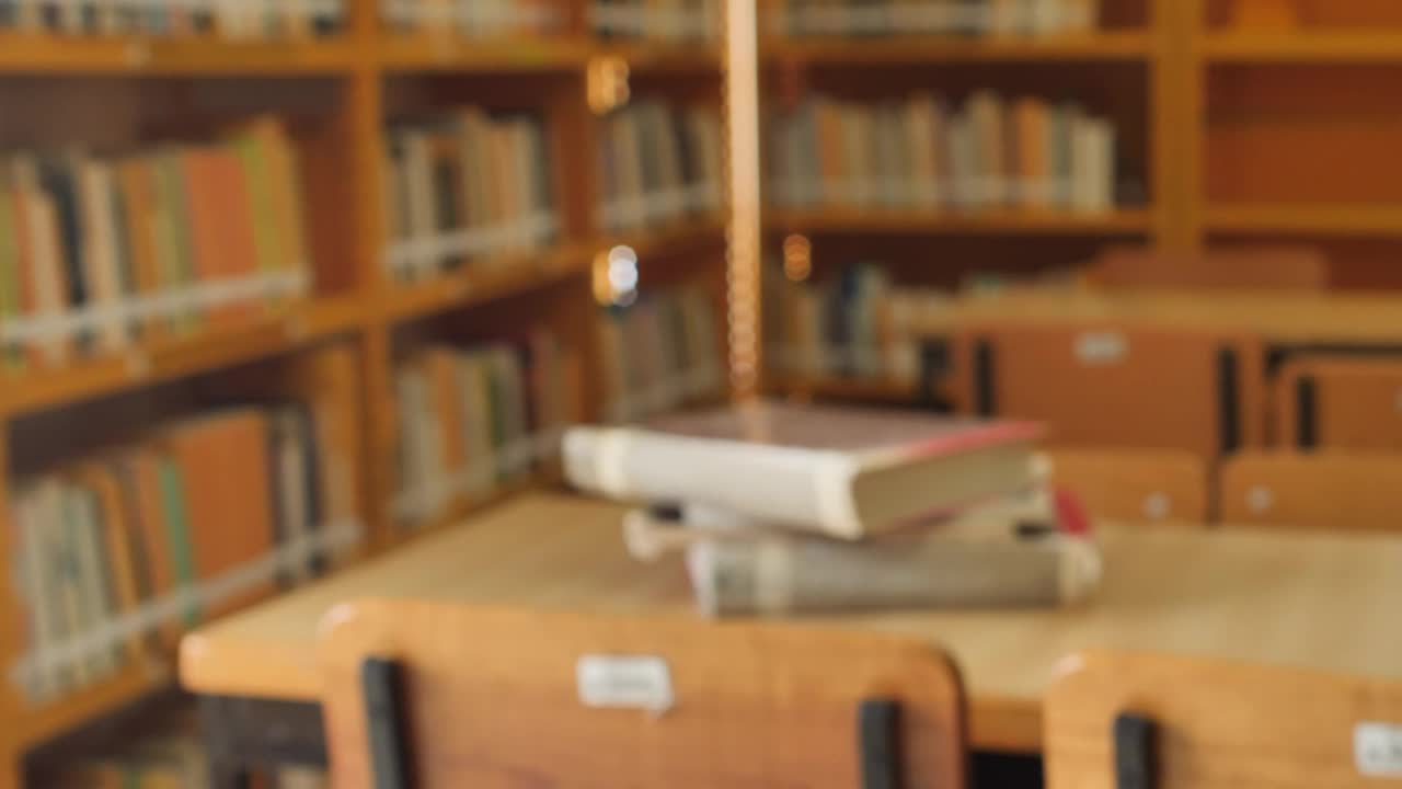 Download Stock Video Focus On A Stack Of Books In A Library Live Wallpaper For PC