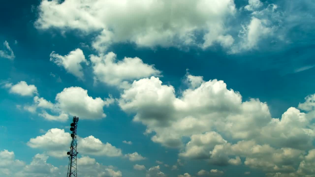 Download Stock Video Fluffy Clouds Over A Broadcast Tower Live Wallpaper For PC