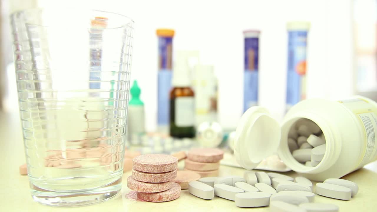 Download Stock Video Filling A Glass Surrounded By Many Drugs Live Wallpaper For PC