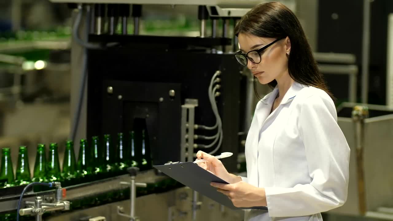 Download Stock Video Female Inspector Checking Beer Production Live Wallpaper For PC