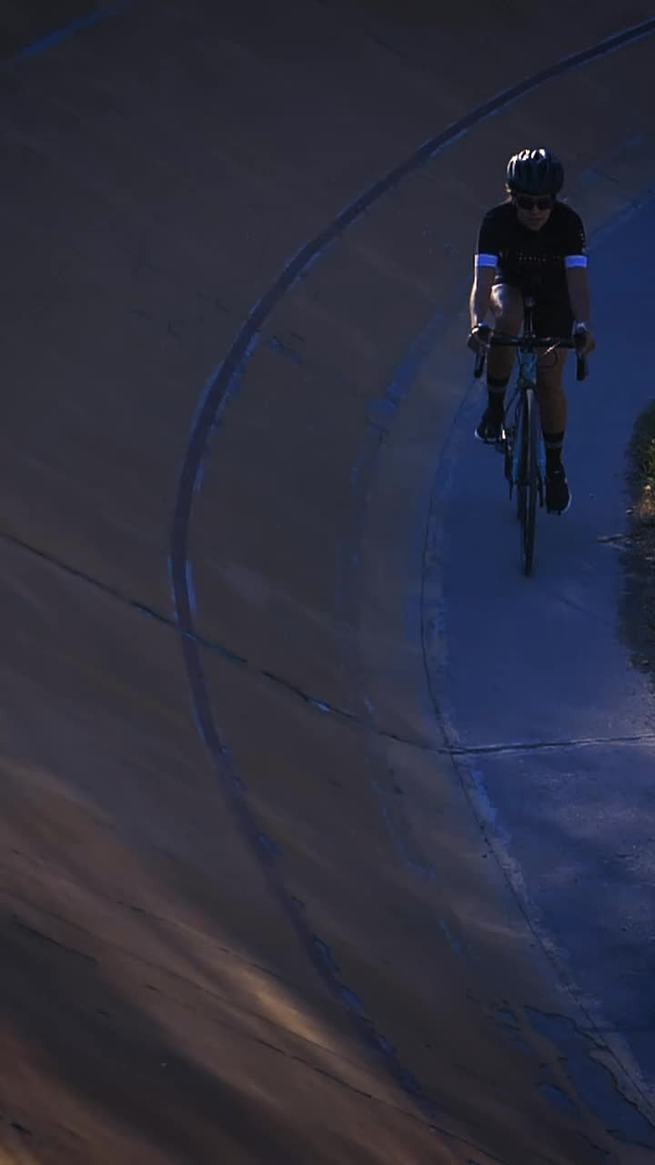 Download Stock Video Female Cyclist Riding Down A Cycling Track By The Edge Live Wallpaper For PC