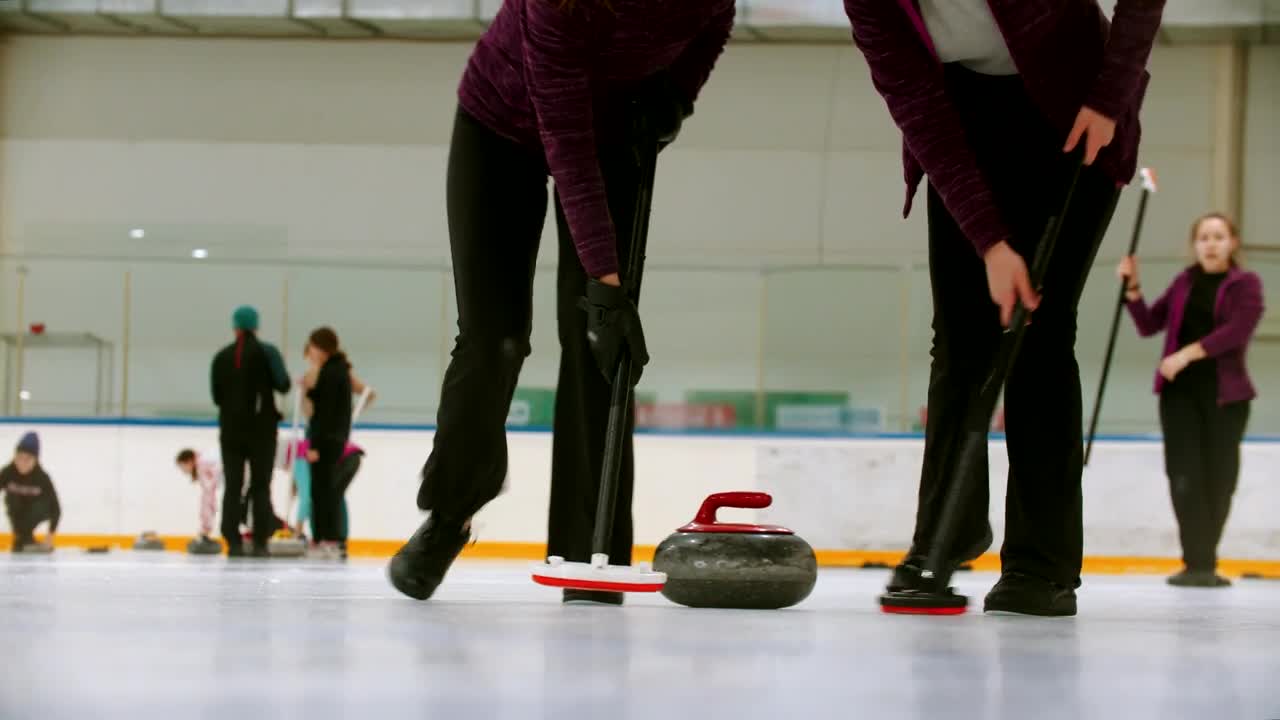 Download Stock Video Female Curling Players In A Shot Close To The Ice Live Wallpaper For PC