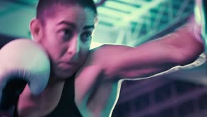 Download Stock Video Female Boxer Punching A Boxing Bag Live Wallpaper For PC